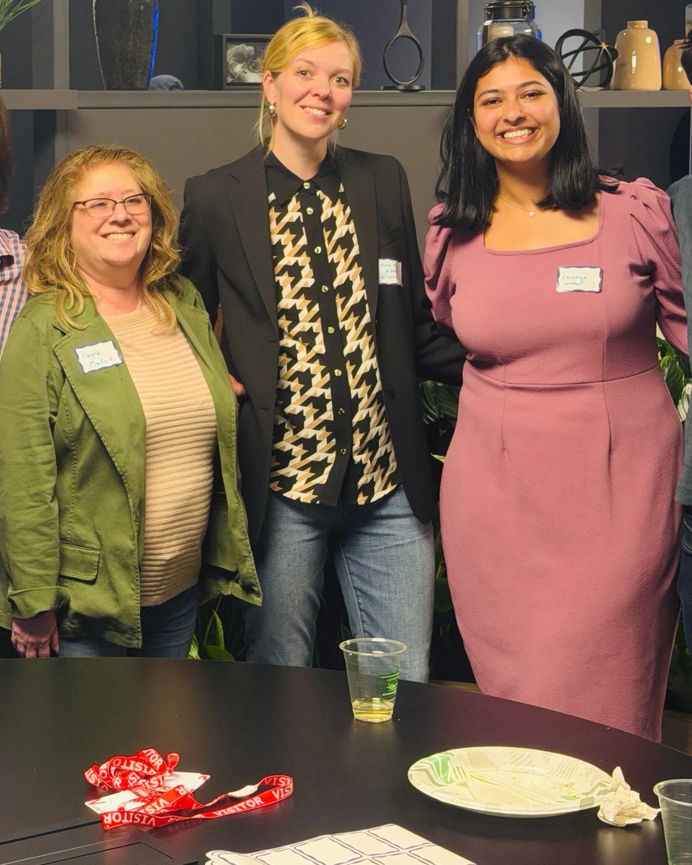 Three women smiling together at a ChiPMA event